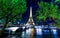 Paris night cityscape. Eiffel tower light show on Seine river