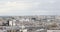 Paris rooftops view and Eiffel Tower, pan view in a cloudy day in France