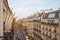 Paris street and ancient buildings seen from balcony in a warm sunset in France