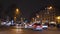 Paris street at night with commuters cars