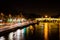 Paris wharf at night with trailing lights of the cars driving by