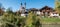 Parish church at riverside of Prien river, Aschau im Chiemgau village, autumn landscape