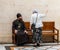 A parishioner talks to an Orthodox priest in Alexander Nevsky church in Jerusalem, Israel