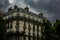 Parisian architecture building with cloudy sky