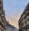 The Parisian buildings and the evening sky in Paris, view of the haussmannian building, typical architecture of Paris, France