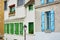 Parisian buildings with green and blue window shutters