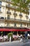 Parisian cafe with terrace and people at Place de la Bastille. Paris, France.