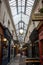 Parisian covered passage, passage des panoramas with typical retro signs of shops and boutiques.