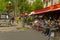 Parisian people sitting at the terrace cafe brasserie restaurant in Paris