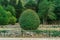 Park on the Adriatic coast. Stone-paved terrace walls and gravel paths. Lush Mediterranean vegetation