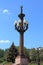 Park architecture. Granite column with lanterns.