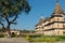 Park around buildings with stone domes in indian Orchha. Cenotaph was built in 17th century in India