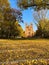 Park in autumn and St. Thomas Church in Berlin, Kreuzberg -