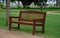 Park bench brown with backrest english type beige path thresh lawns wet rain rainy threshing