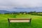 Park bench outdoor landscape. Wooden bench in golf course landscape. Mountain park bench panorama. Park bench relax