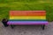 Park bench painted in the vibrant pride colors