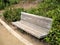 Park bench in a Santa Barbara, California botanical garden with paths and plants
