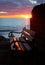 Park bench at sunset by the sea