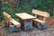 Park bench with table made of natural wood