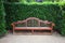 Park bench in topiary garden