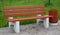Park bench with an urn for rubbish