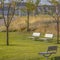Park with benches lit by sunlight in Daybreak Utah