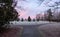 Park in a city neighborhood during a winter sunrise.