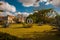 Park in front of the entrance. Sculpture of Leonardo da Vinci in the circle and square. Castillo de la Real Fuerza, fortress Castl