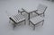 Park furniture chess table and chairs for four people made of light metal and wooden beams with backrest. on a bright snowy plain