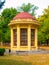 Park gazebo with red roof and yellow facade, Terezin, Czech Republic