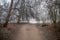 Park landscape in Leipzig in winter with frosty foggy weather