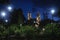 Park at main square `Francisco Canton Rosado` with towers of the church San Servacio at night in the downtown of Valladolid,