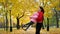 In the park mother and daughter whirling