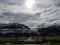 Park overlooking the mountain in a cloudy day with sun barely showing at Interlaken Switzerlan