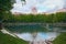 Park with Patriarshiye ponds among residential houses at summer