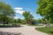 park with playground, basketball court, and picnic area visible in residential neighborhood scene