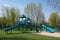 park with playground, swings, and slides for children