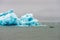 Park ranger in rubber boat in Jokulsarlon/Fjallsarlon glacier lagoon by the foot of Vatnajokull volcano in Iceland