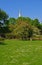 A Park in Riga during Summer Time with the tall Freedom Monument at the back