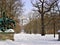 Park, sculpture, bare trees, snow, winter and sky