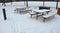 Park seating with wooden tables and benches for picnic