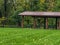 Park shelter building with picnic tables