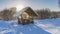 In the park, among the snowdrifts, there is a wooden gazebo