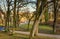 Park with trees and view of the mill in Schwerin. Old watermill in Mecklenburg-Vorpommern