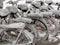 Parked bicycles covered in snow