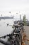 Parked bicycles on Lake Constance in Germany. There are gulls flying on the background. Harbor pier in town Constance.