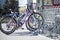 Parked bikes in a parcking rack in front of supermarket