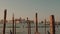 Parked gondolas on Piazza San Marco and The Doge\'s Palace embankment with the bell tower of the Saint Giorgio Maggiore