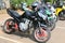 Parked motorbikes at Yearly Mass Ride with Black Suzuki Racing