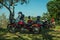 Parked motorcycles under shade in countryside